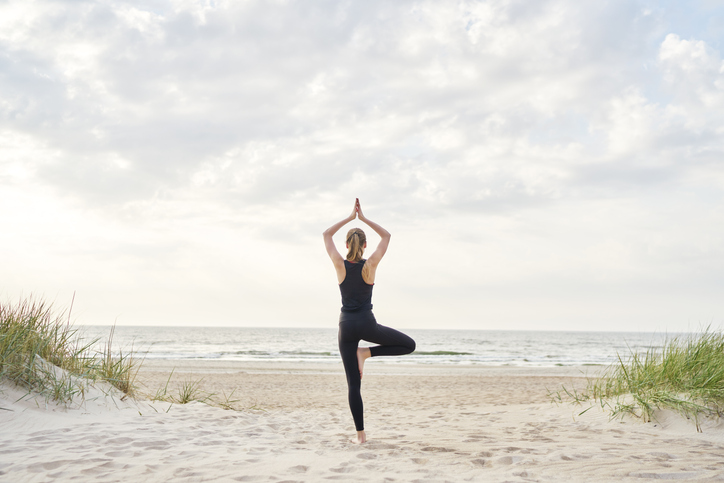 women practicing yoga at summer yoga retreat